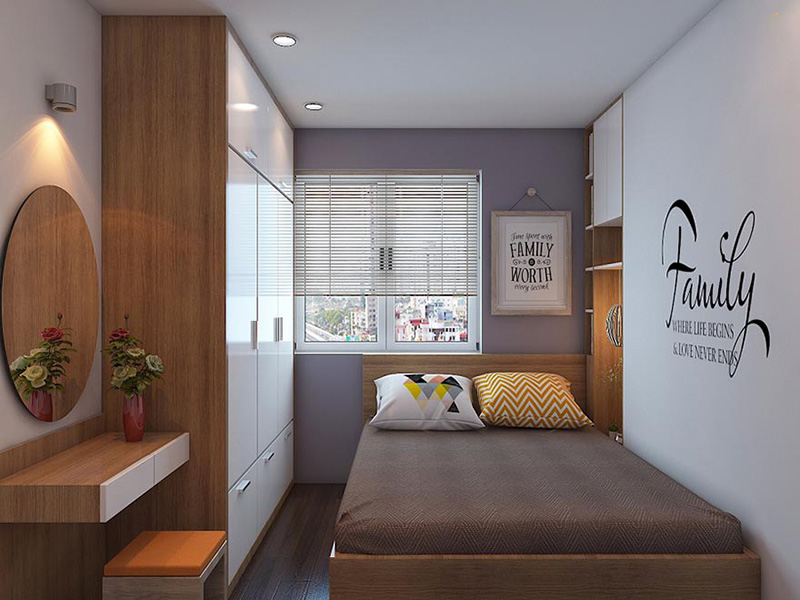 A bedroom with a bed and a desk Description automatically generated