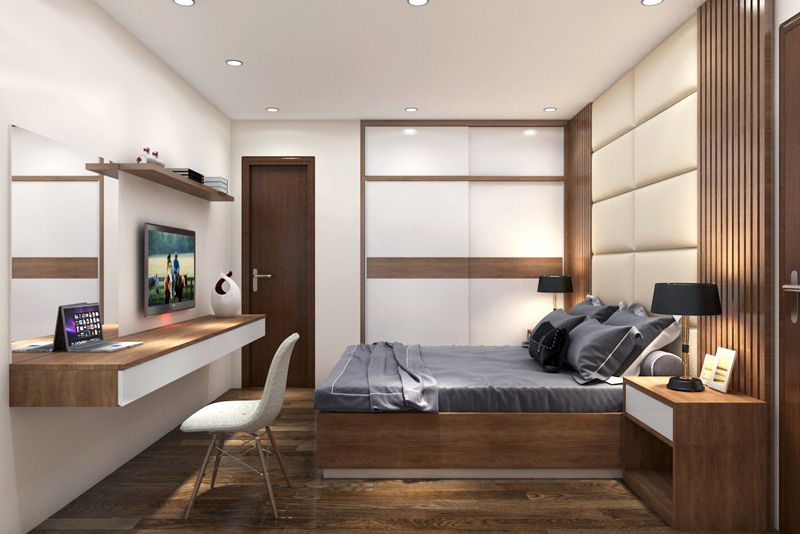 A bedroom with a desk and a bed Description automatically generated