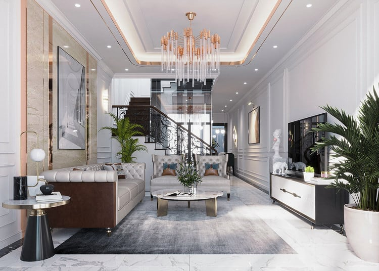 A living room with a chandelier and couches Description automatically generated