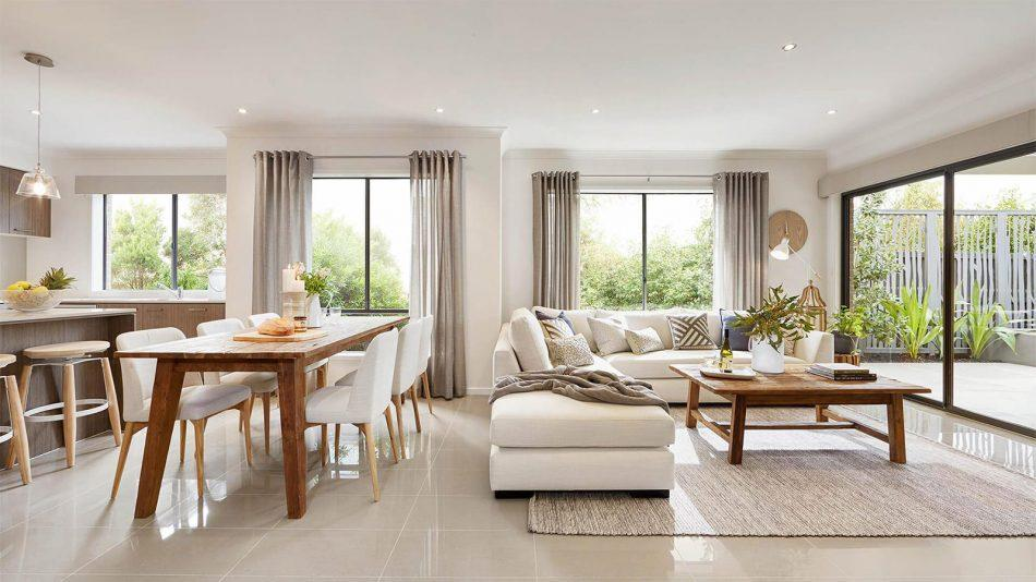 A living room with a table and chairs
Description automatically generated