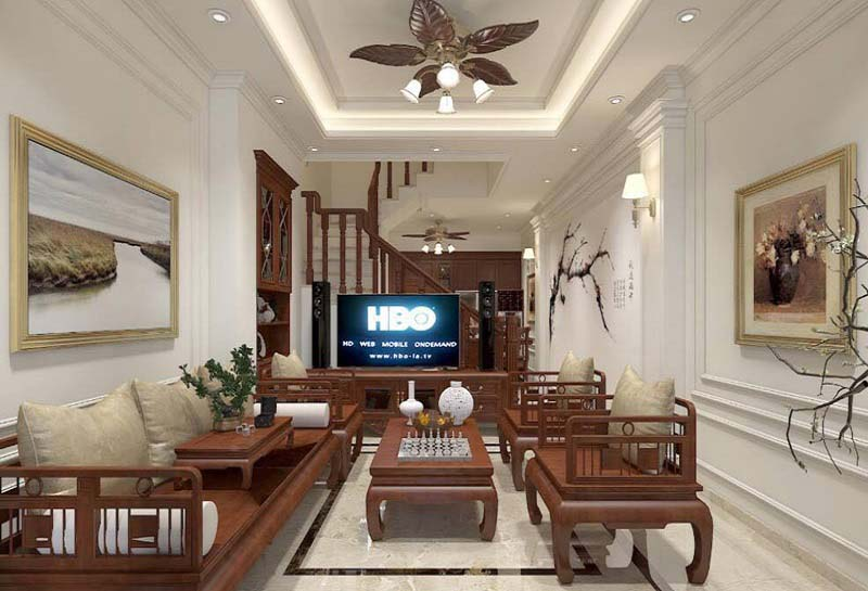 A living room with a television and a couch Description automatically generated