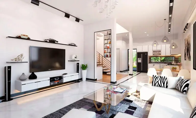 A living room with a tv and a staircase Description automatically generated