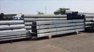 A stack of metal pipes Description automatically generated