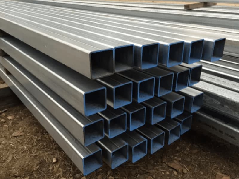 A stack of metal pipes Description automatically generated