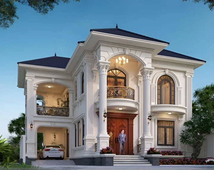 A white house with a car parked in front of it Description automatically generated