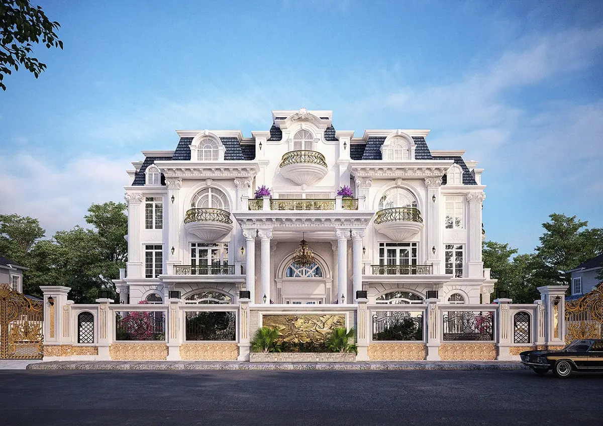 A white house with a fence Description automatically generated